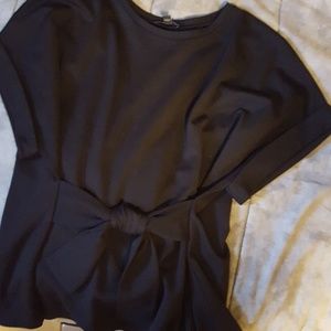 The front , cuffed short sleeved